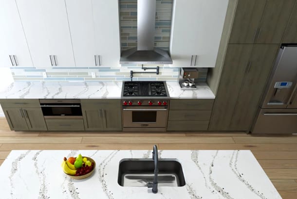 Kitchen with white granite counters and stainless steel range.