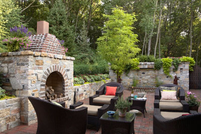 Fireside seating next to a stone fireplace