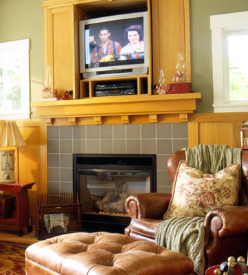 A fireplace with a tv over it