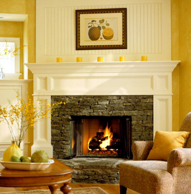 A stone fireplace built into a mantel