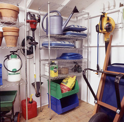 Gardening tools organized onto shelves