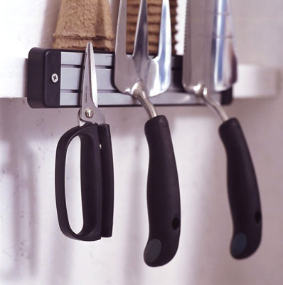 Hand tools hanging on a magnet