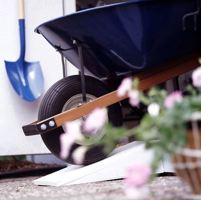 Wheelbarrow rolling down a ramp