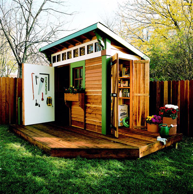 A wooden shed with a small deck