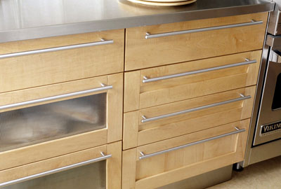Cabinet drawers with handles that run the length of the drawer