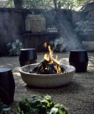 A firepit with small barrells around it