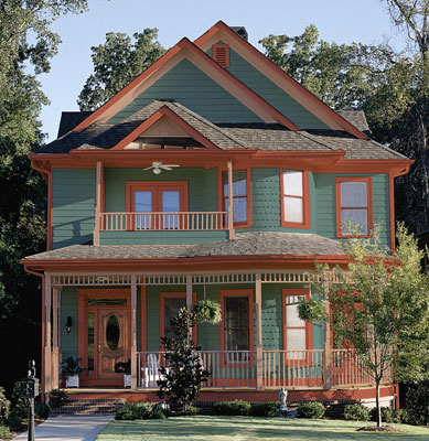 A rendered exterior view of a house with green walls