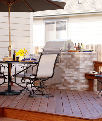 A deck with a built-in grill