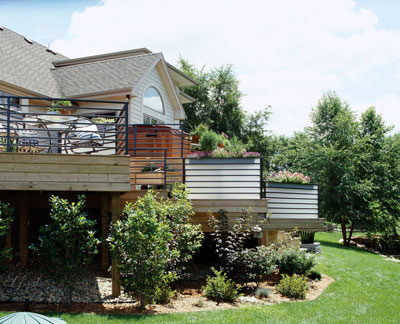 A raised deck overlooking the yard