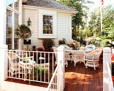 Attached deck with wicker dining set