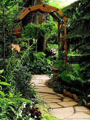 A stone path going underneath an archway