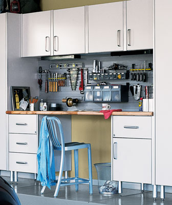 Organized work bench with metal cabinets