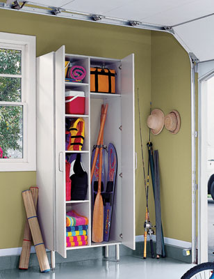 A full-height cabinet storing water and camping equipment