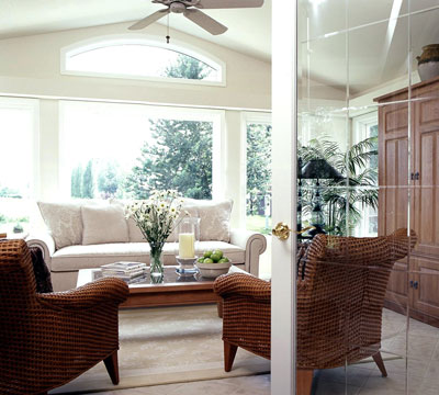 A living room with full-height windows