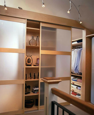 A closet hidden behind translucent sliding doors