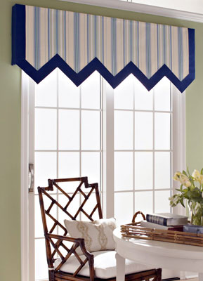 An upholstered cornice can draw attention away from drab doors