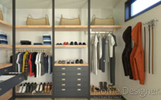 Interior rendering of a well-organized walk-in closet, showcasing modular shelving, hanging rods for clothing, drawers, and various accessories like baskets and shoe storage, designed for efficient garment and item storage.